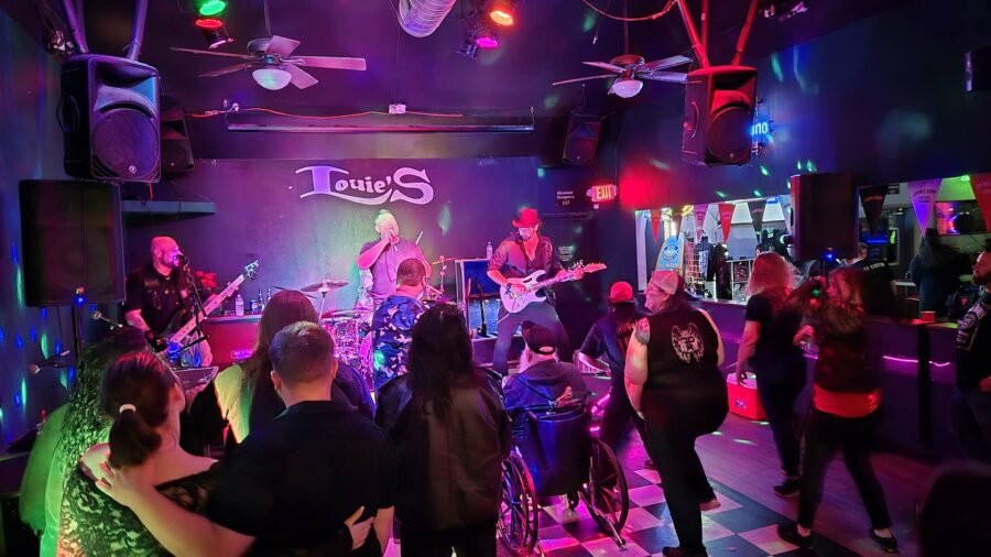 A band playing to a full dance floor at Louie's
