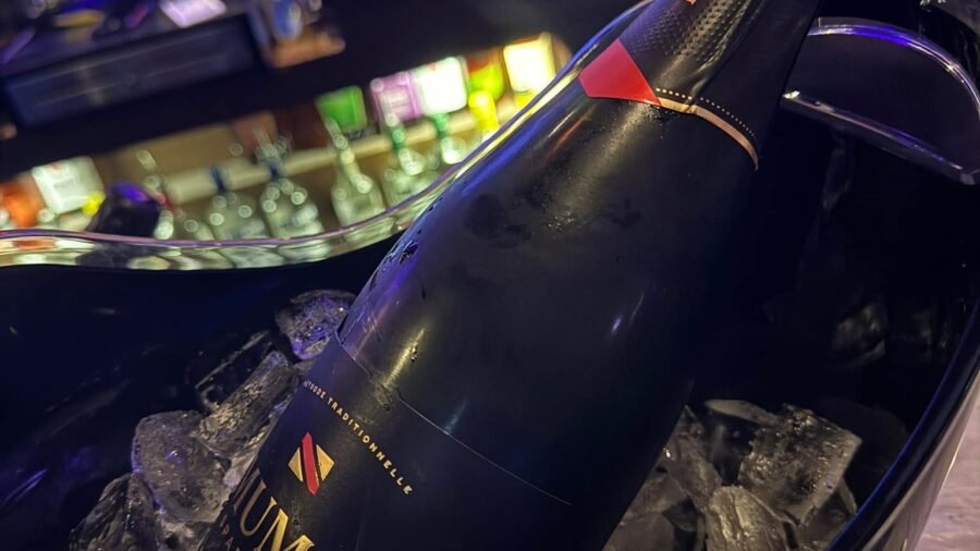A bottle of champagne in an ice bucket