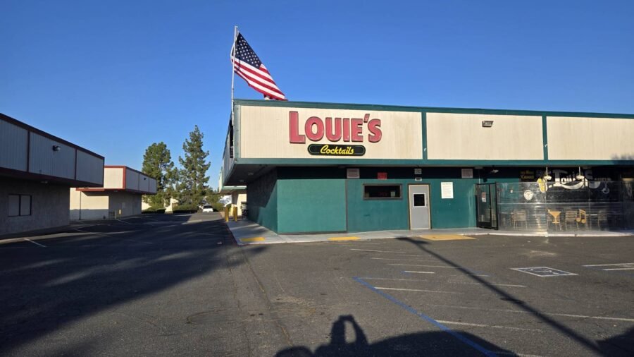 The front of Louie's Cocktail Lounge in daylight