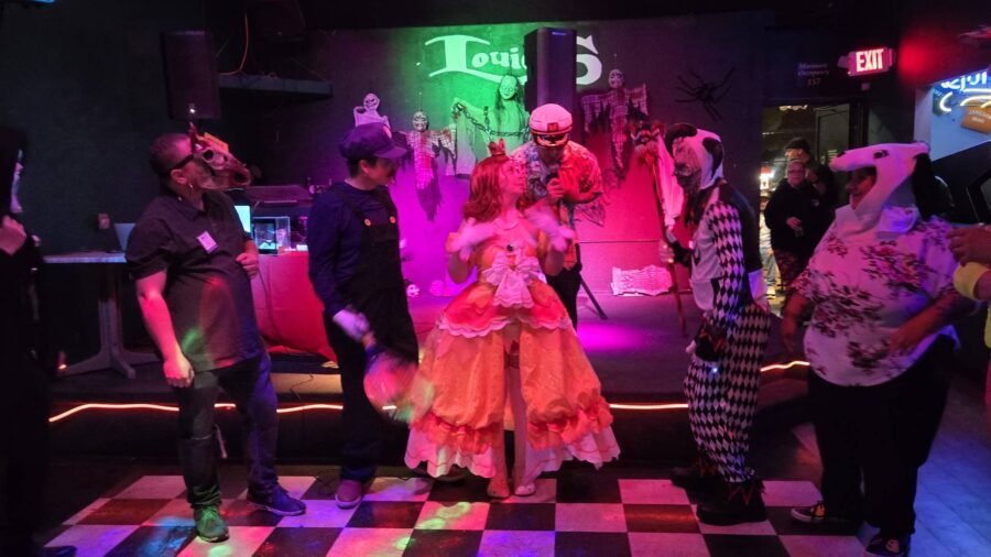 Customers in costume on the dance floor at Halloween