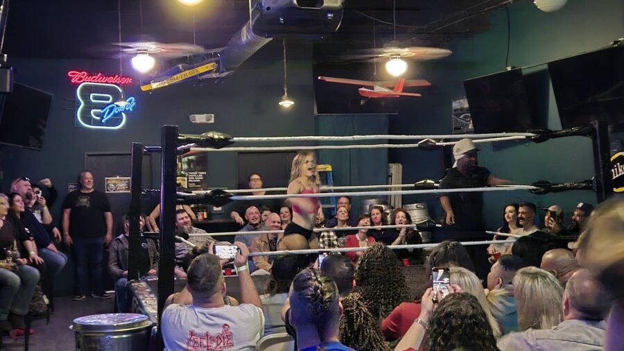 A wrestling ring set up at Louie's with a crowd around it